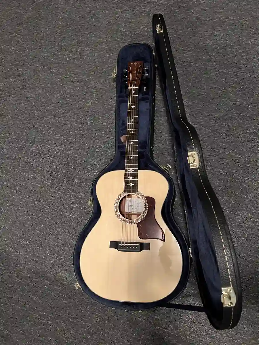 Acoustic guitar in blue case