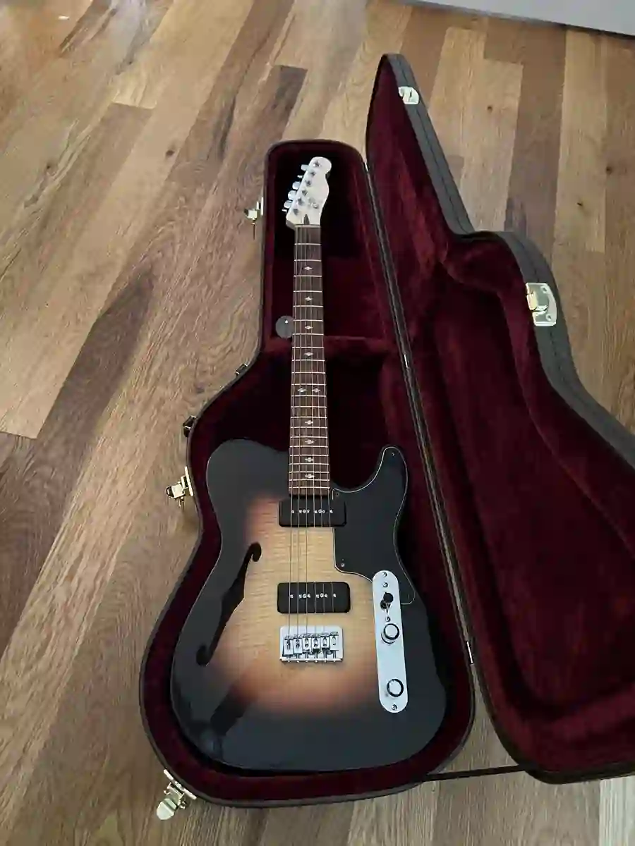 Custom electric guitar in case with alternate pickguard